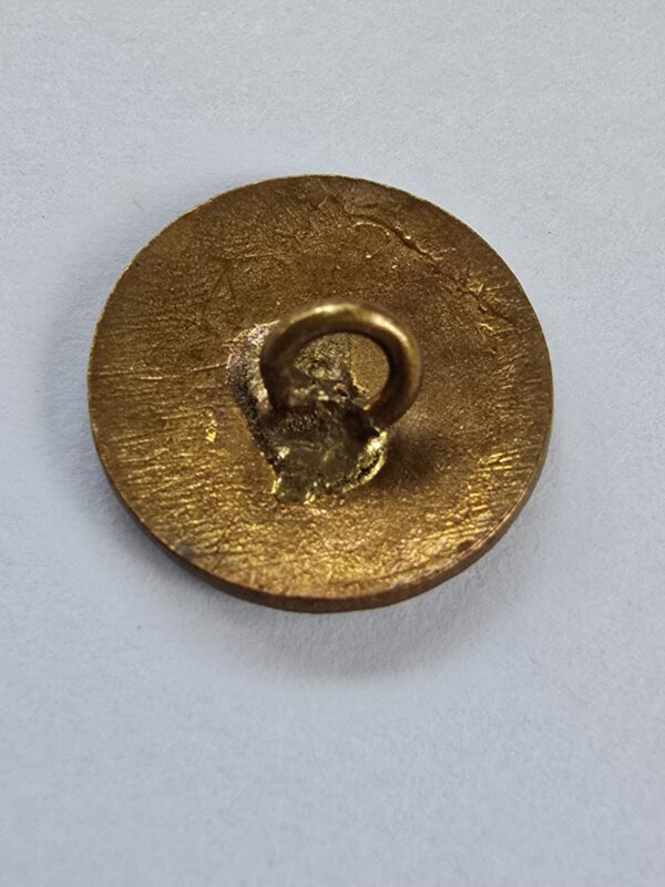 A set of Stamped Brass and Enamel Buttons