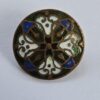 A set of Stamped Brass and Enamel Buttons