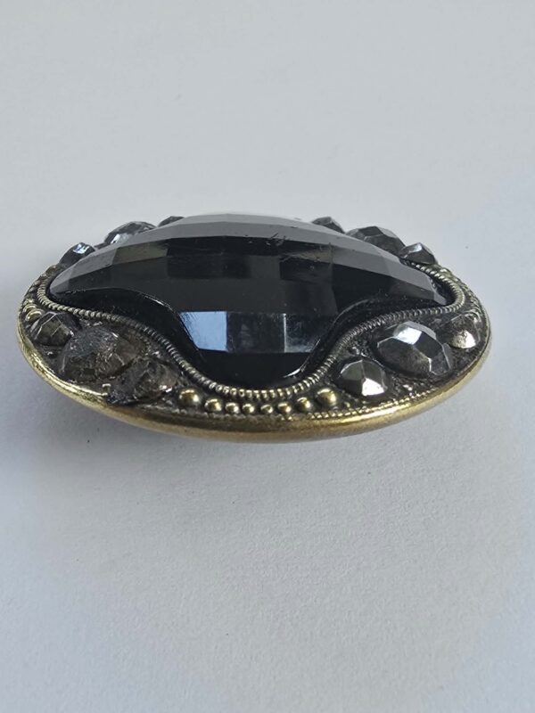 Black Glass with a Brass and Cut Steel Button