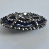 8407aabf-7de2-4b63-91e9-286cb72ebc26 Cut Steel Over Blue Glass Button