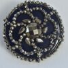 96168230-24f5-465e-8e2f-d34b87793f6b Cut Steel Over Blue Glass Button