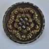 f5406d64-b8d9-47db-aac3-4a617170e570 A Steel and Stamped Brass Button