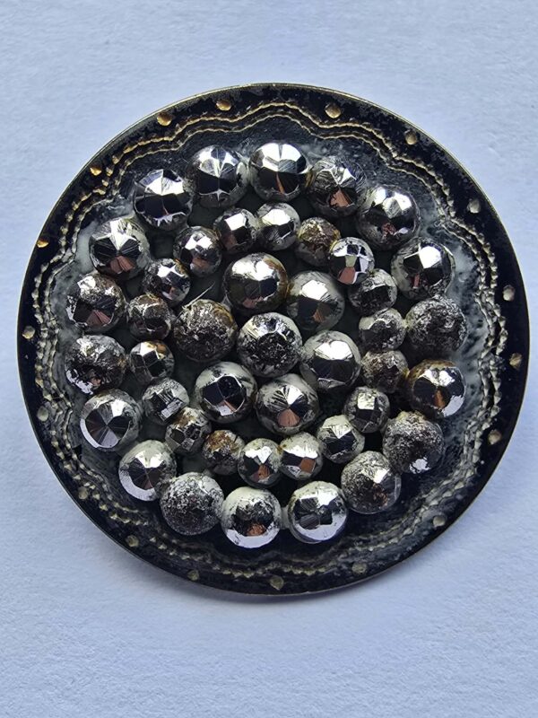 A Set of Cut Steel Mounted on Brass